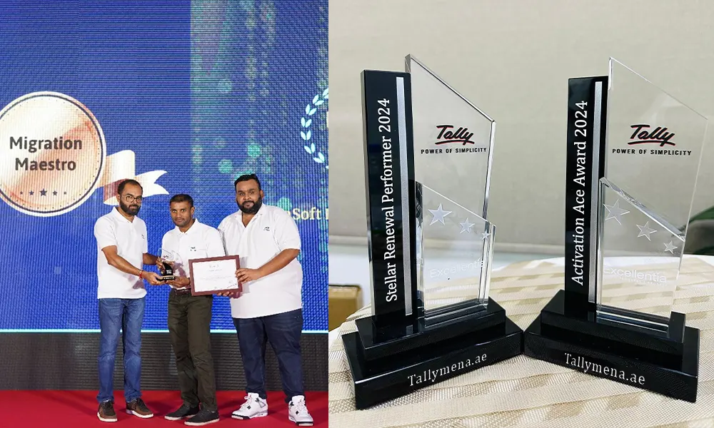 Tally Mena team receiving a Tally partner award alongside Tally Prime trophies
